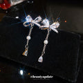Crystal Bow and Pearl Tassel Drop Earrings in Silver Tone view 2