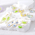 Gold Tone Pressed Botanical Resin Earrings in Six Shapes view 1