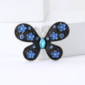 Floral Butterfly Brooch in Metal with Black Enamel Wings Dotted with Small Flowers view 2