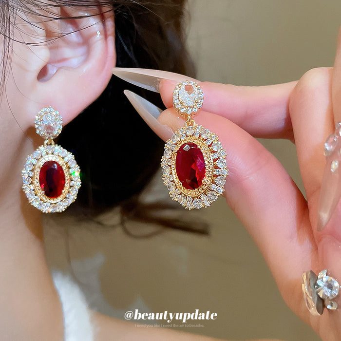 Gold Tone Red Oval Crystal Drop Earrings with Clear Halos