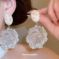 Oversized Resin Flower Drop Earrings In Black And Clear view 3