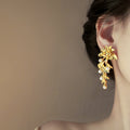 Gold Tone Leaf and Pearl Cascade Statement Earrings view 2