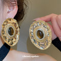 Textured Gold Tone Oval Stud Earrings With Brown Centers view 2