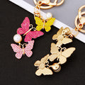 Three Butterfly Drop Keychains in Pink Yellow Purple and White Crystal Palettes view 2