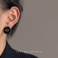 Black Enamel Round Camellia Stud Earrings Gold Tone Prongs view 2