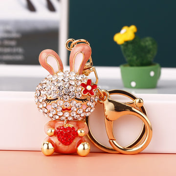 Jeweled Strawberry Holding Rabbit Keychains in Four Pictured Colors