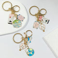 Gold Tone Travel Tag and Globe Split-Ring Keychains in Three Designs view 1