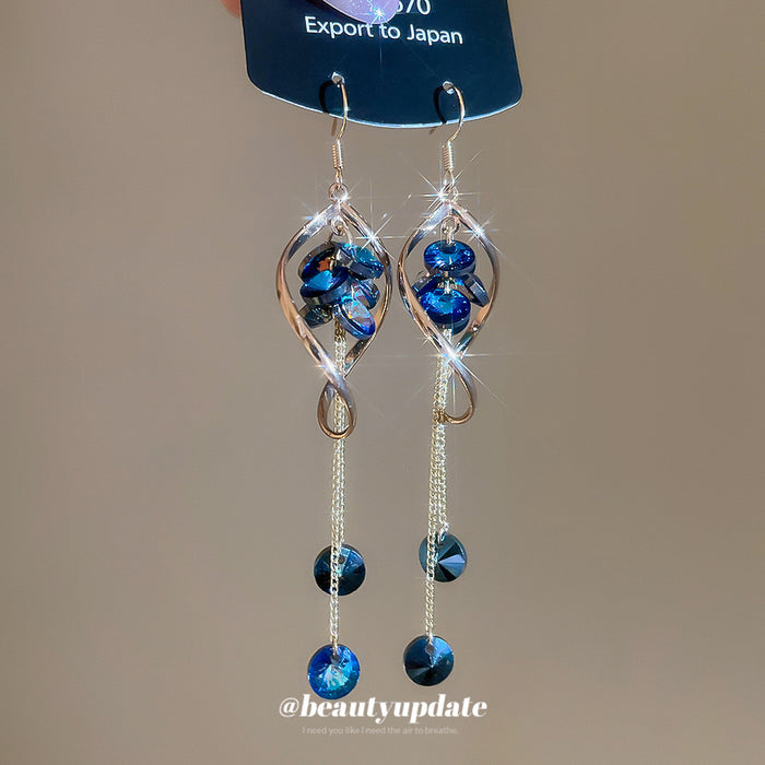Blue Crystal Twisted Loop Dangle Hook Earrings with Polished Metal Details