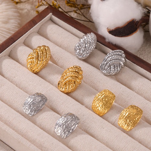 Gold and steel hammered shell and square studs in linen jewelry tray