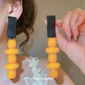 Geometric Wood Bead Dangle Earrings in Two Colorways view 3