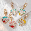 Gold Tone Abstract Face Pressed Flower Resin Clip Keychains view 1