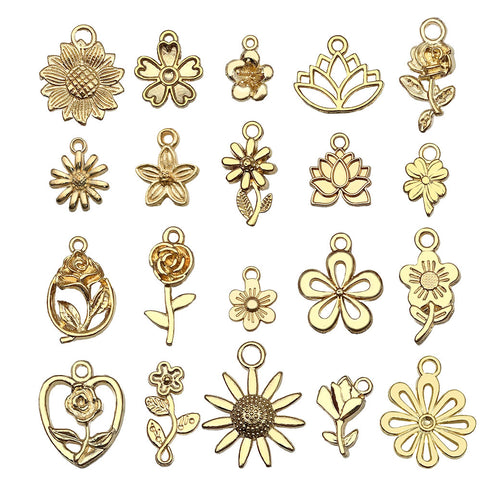 Gold-tone sunflower charms arranged on a light background