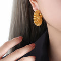 Hammered Spring Coil Hoop Earrings Gold and Steel Tone view 1