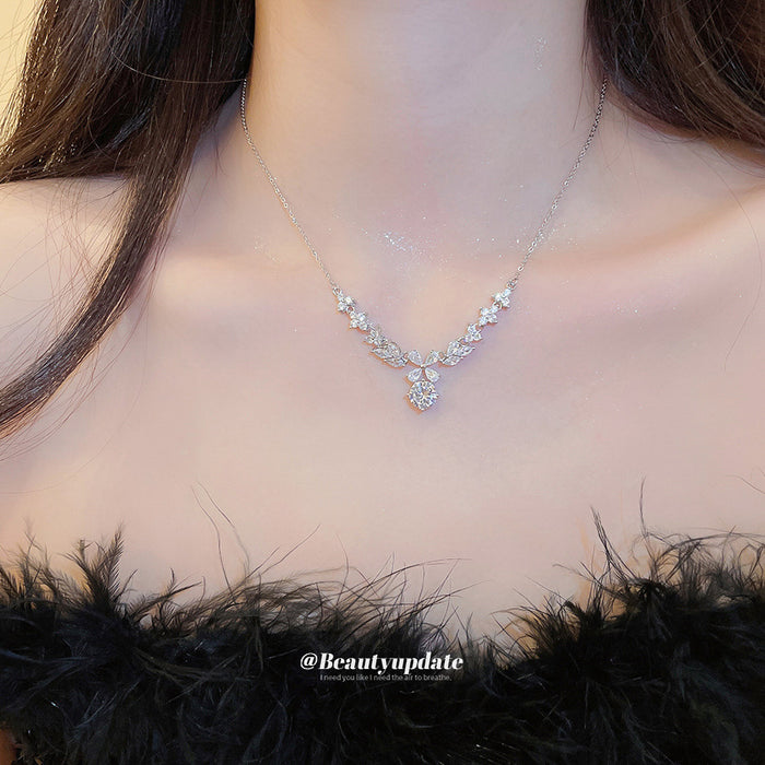 Silver Tone Floral Necklace with Iridescent Crystal Drops