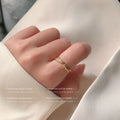 Crossed Open Rings In Polished Silver And Gold Tone view 2