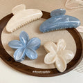 Four Blue And White Marbled Hair Claws In Standard Or Flower Shapes view 3