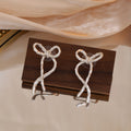 Hammered Ribbon Bow Gold and Silver Long Stud Earrings view 7