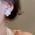 White Petal Flower Pearl Drop Stud Earrings With Polished Metal Details view 3