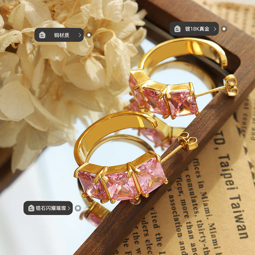 Gold pink crystal C earrings on tray copper plating zircon labels