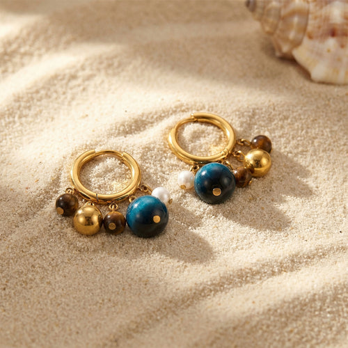 Display view of tiger eye and pearl cluster hoop earrings in main image 2.