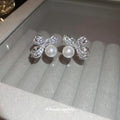 Silver Tone Crystal Bow Stud Earrings With White Pearl Drops view 2