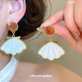 White Shell Fan Drop Earrings with Brown Oval Studs view 1