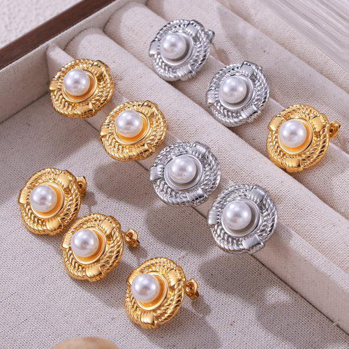 Gold and silver twisted rope pearl earrings in fabric tray