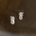 Silver Tone Bow White Potion Bottle And Blue Stone Stud Earrings view 4