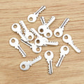 Mini Key Shaped Metal Charms in Four Finish Options view 2