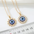 Gold Tone Crystal Sun Blue Evil Eye Pendant Necklaces in Two Designs view 4