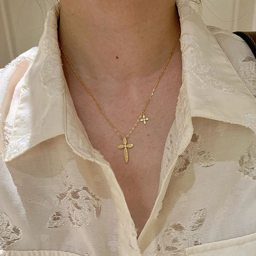 Product image 2 showing a slim gold tone chain with a clear crystal cross pendant