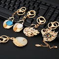 Mixed Rocking Horse Swan Peacock and Cross Keychains in Eight Designs view 4