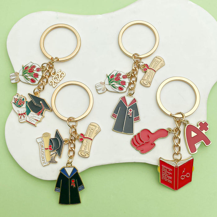 Graduation Charm Keychains Featuring Red Book Across 31 Pictured Variations