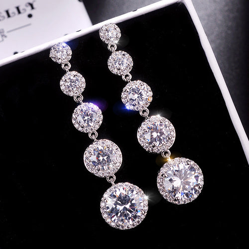 Graduated Round Clear Stone Drop Earrings Metal Jewelry Design shown from an alternate angle