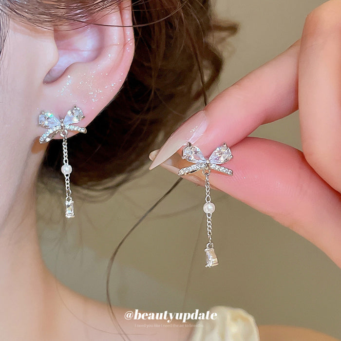 Crystal Bow and Pearl Tassel Drop Earrings in Silver Tone
