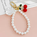 Red Cherry Charm Bag Keychain with Gold-Tone Hardware view 2