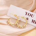 White Pearl Look and Black Flower Gold Huggie Earrings view 4