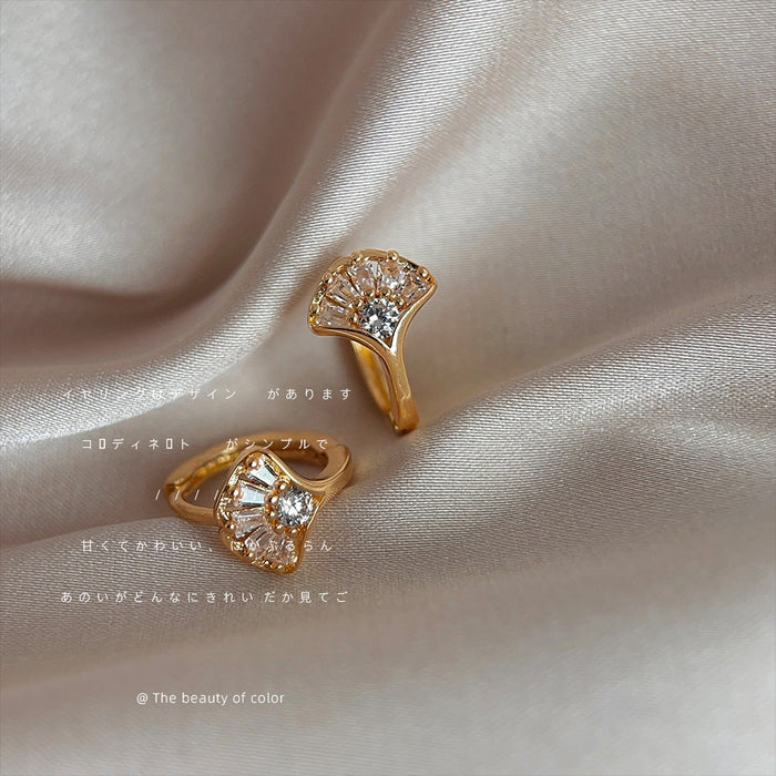 Gold Tone Crystal Fan Huggie Earrings Baguette Leaf Design