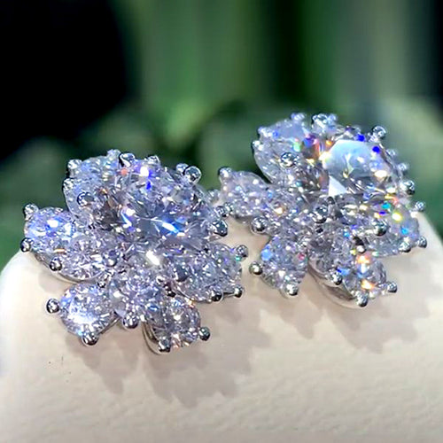 Second product view showing silver-tone round clear solitaire floral halo stud earrings