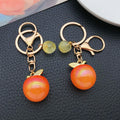 Iridescent 3D Apple Keychains in 6 Glossy Fruit Colors view 2