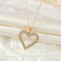 Gold Tone Bright Red Crystal Open Heart Pendant Necklace view 5