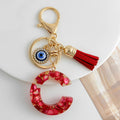 Red Resin Shell Letter Keychain with Evil Eye and Tassel view 3