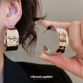 Wide Polished C Hoop Earrings in Gold and Silver Tone Finishes view 3