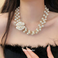 Layered Faux Pearl Necklace with White Floral Centerpiece view 3