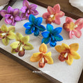 Colorful Resin Orchid Stud Earrings In Five Tropical Shades view 3