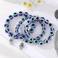 Silver Tone Blue Evil Eye Bead Stretch Bracelets in Two Sizes view 1
