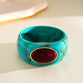 Acrylic Wide Bangle with Oval Gold-Framed Cabochon view 12