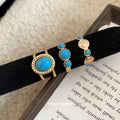 Gold Open Ring Oval Blue Stone Twisted Rope Border view 2