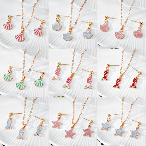 Nine ocean shell mermaid tail and starfish necklace earring sets in a grid