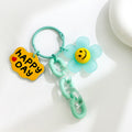 Smiley Daisy Charm Keychain with Acrylic Chain and Happy Day Tag view 3